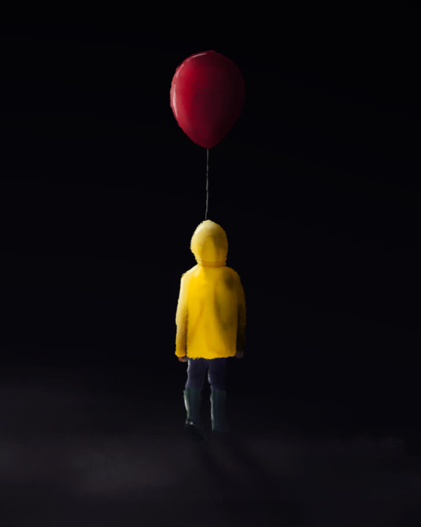 A child in yellow raincoat holding red balloon, reminiscent of IT movies.